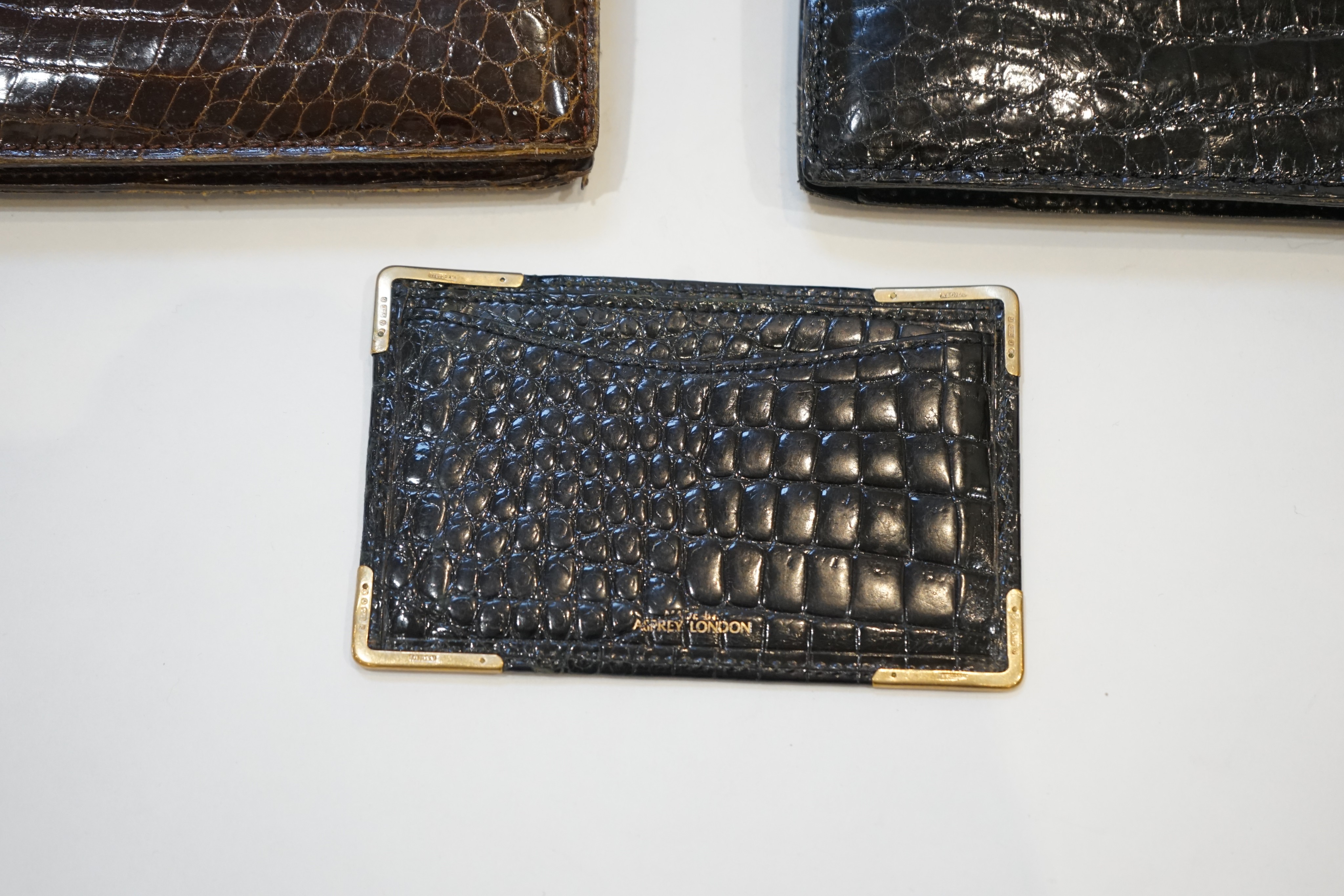 Two Asprey simulated crocodile handbags and a boxed card purse